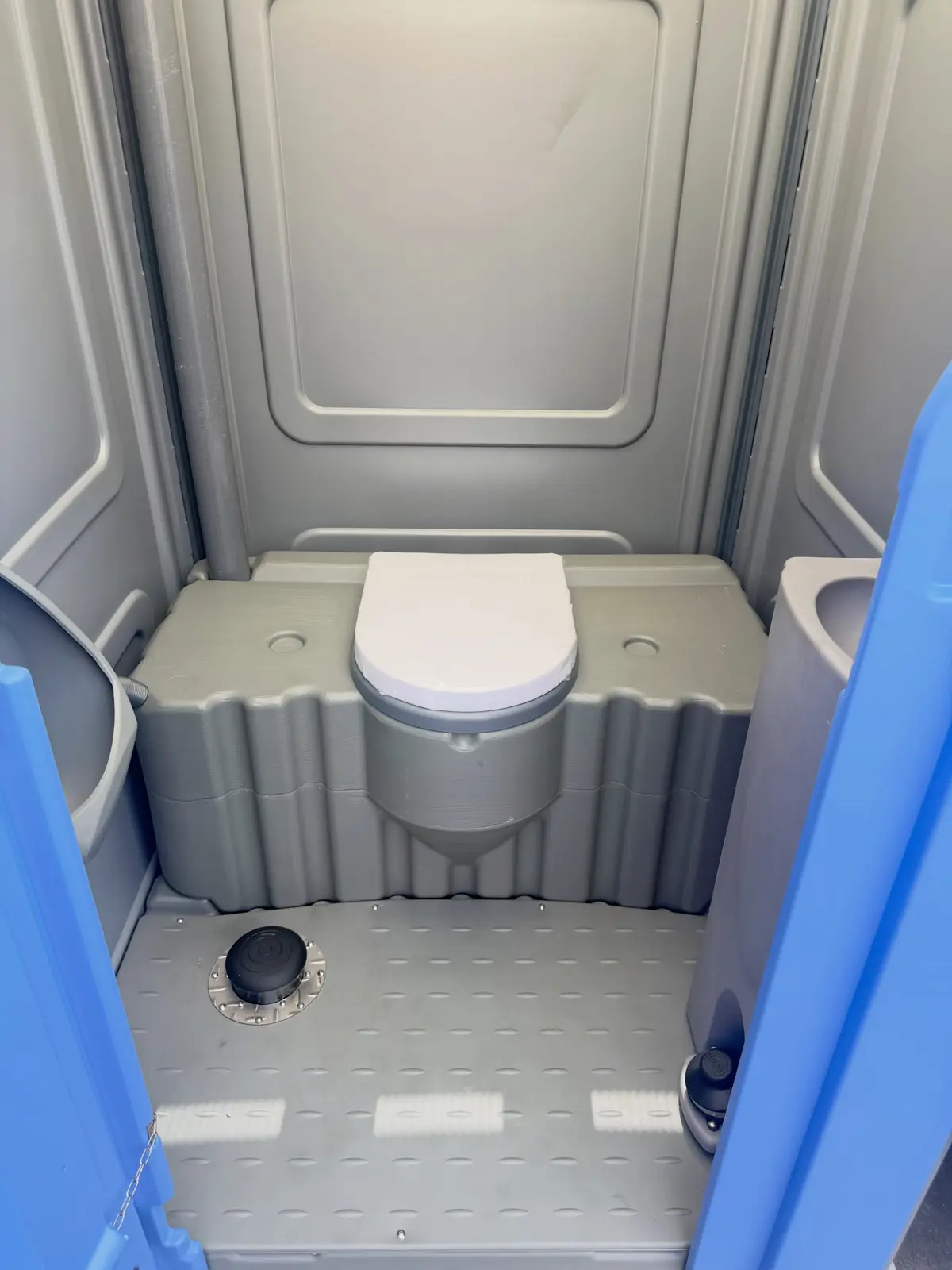 Seat and floor inside a standard porta potty